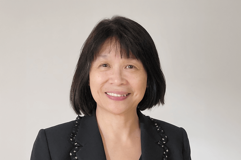 Woman in black shirt smiling