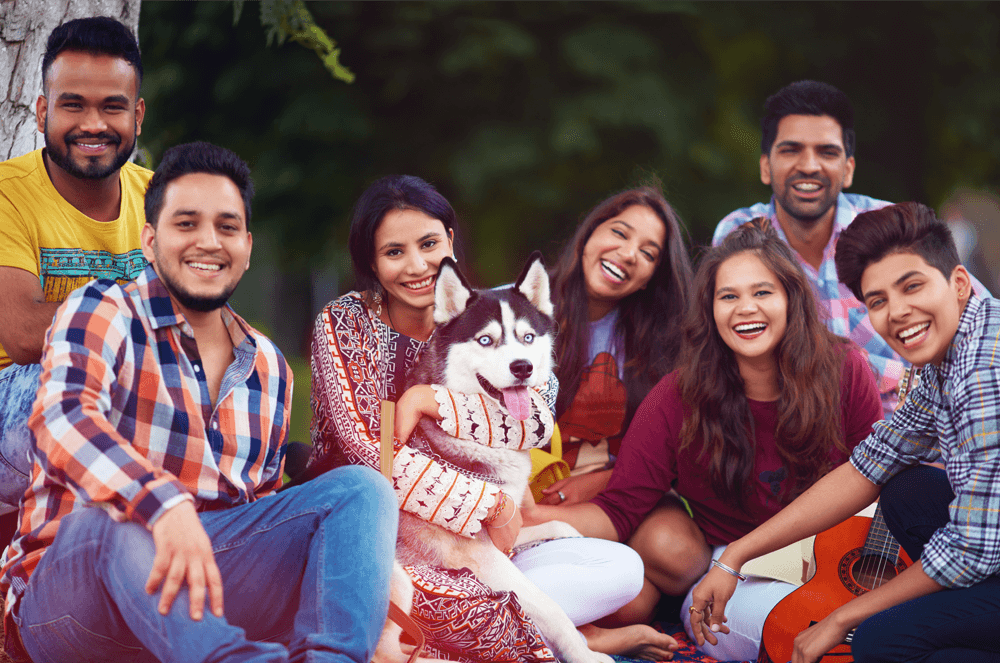 Group of people smiling with dog