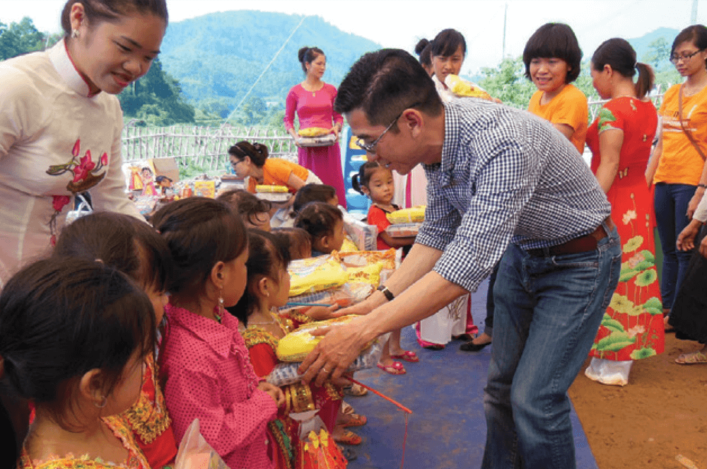 Man standing next to children