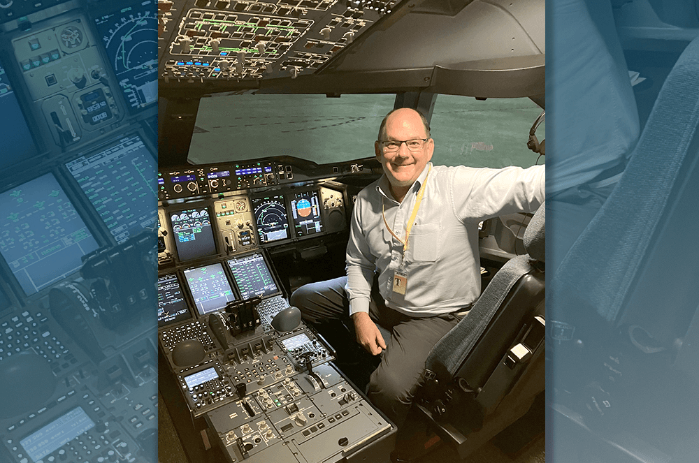 Man sitting on flight deck of airplane