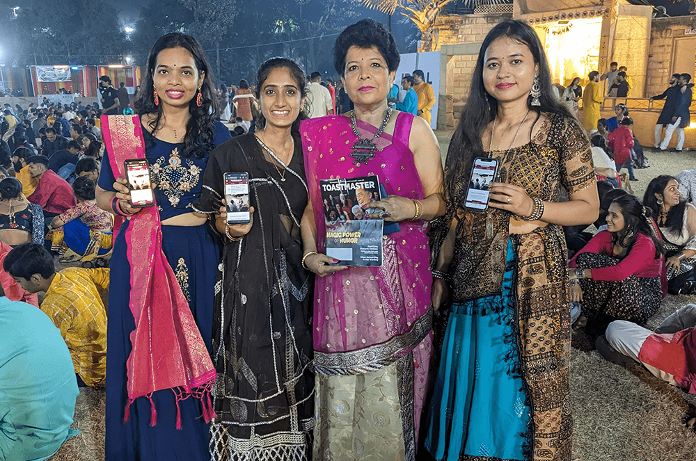 Four women posing outdoors during Hindu festival in India