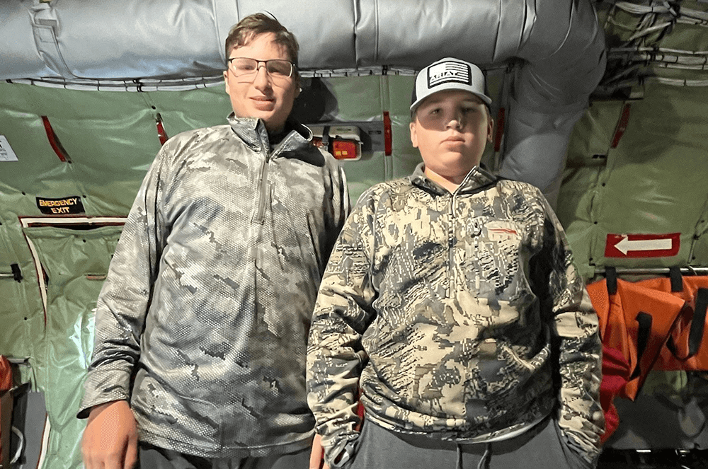 Two boys standing next to each other