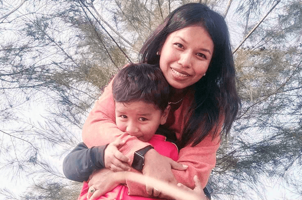 A woman hugging her son