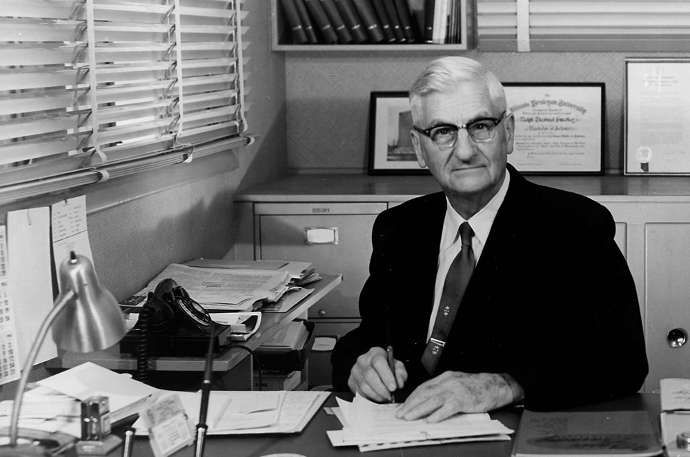 Black and white photo of Toastmasters founder Ralph C. Smedley sitting at his desk