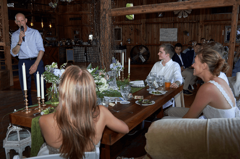 Man standing and giving a wedding speech