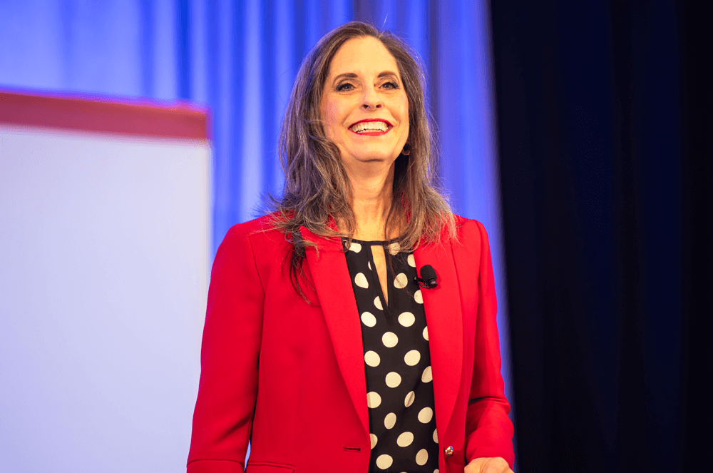 Woman smiling in red blazer