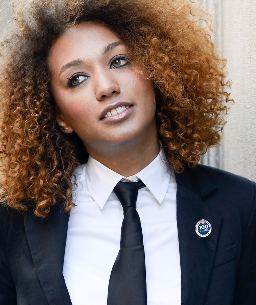 Woman-wearing-100th-anniversary-pin-toastmasters
