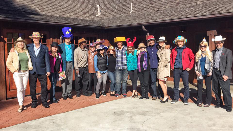 The North Coast Toastmasters club in Encinitas, California, celebrates new members while wearing fun hats.