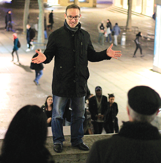 Jonas Grundler, of the Rhetorik im Gebrüder Schmid Zentrum club in Stuttgart, Germany, delivers a speech in Schlossplatz. Photo by Xia Liu