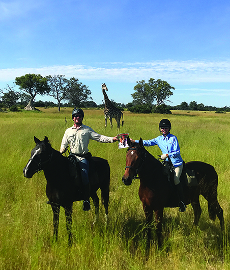 Gale McCreary, CC, CL, and  Michael Trionfetti from California, pose while on safari in the Okavango Delta in Botswana.