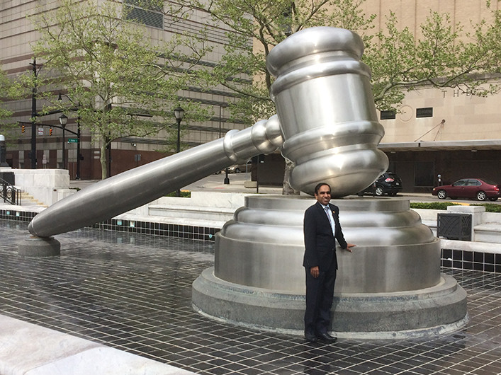 Arunasalam poses in front of the World’s Largest Gavel in Columbus, Ohio.