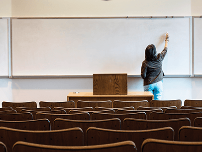 Woman writing on a white board