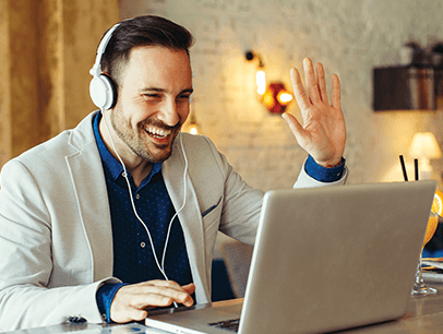 Man on a laptop at a digital team meeting