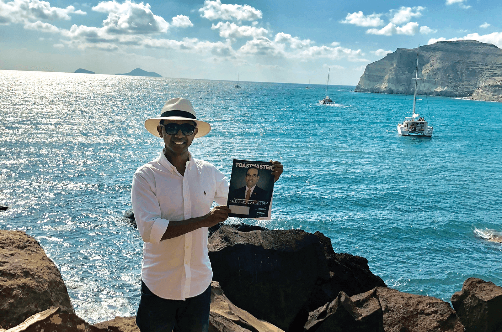 Sourabh Roy, CC, of Newcastle, United Kingdom, takes in the view of the cerulean-blue sea off the Greek island of Santorini.
