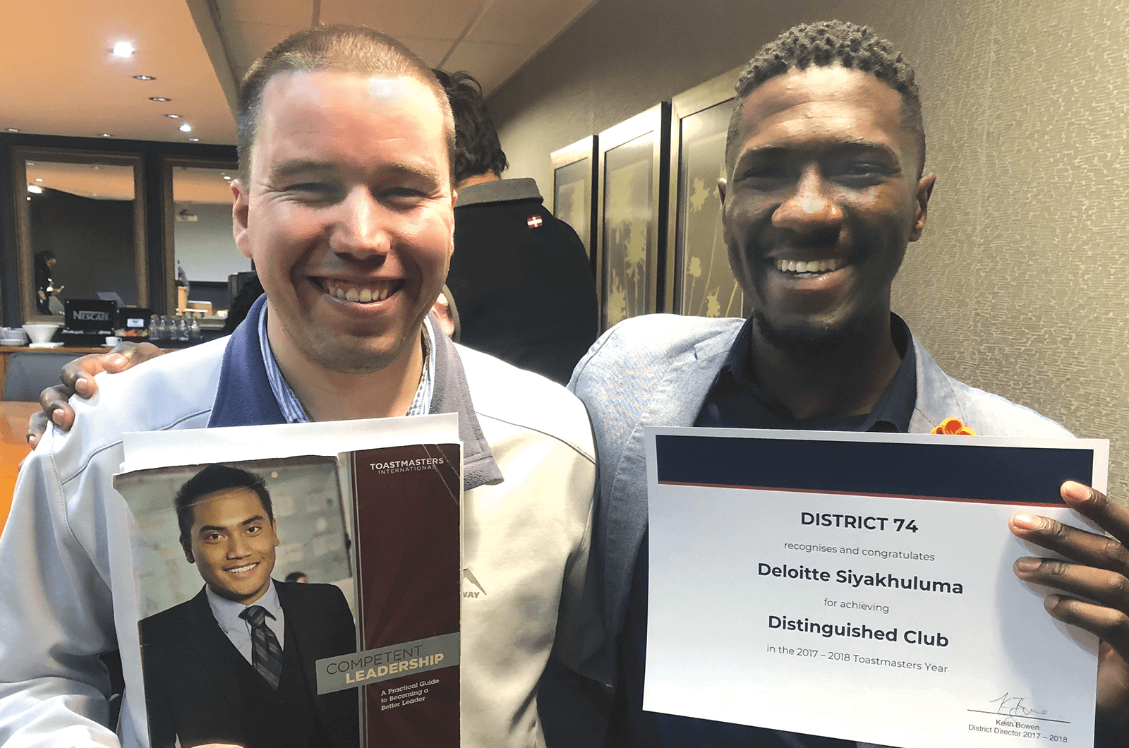 Garth Thomsonand and Matimu Marcus Manganyi hold Distinguished Club certificate