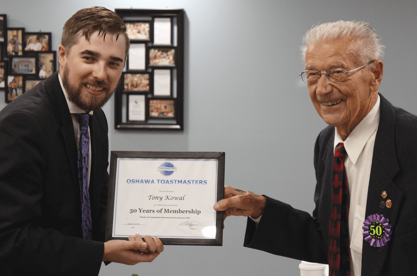 Mitchell Kent presents Tony Kowal with certificate