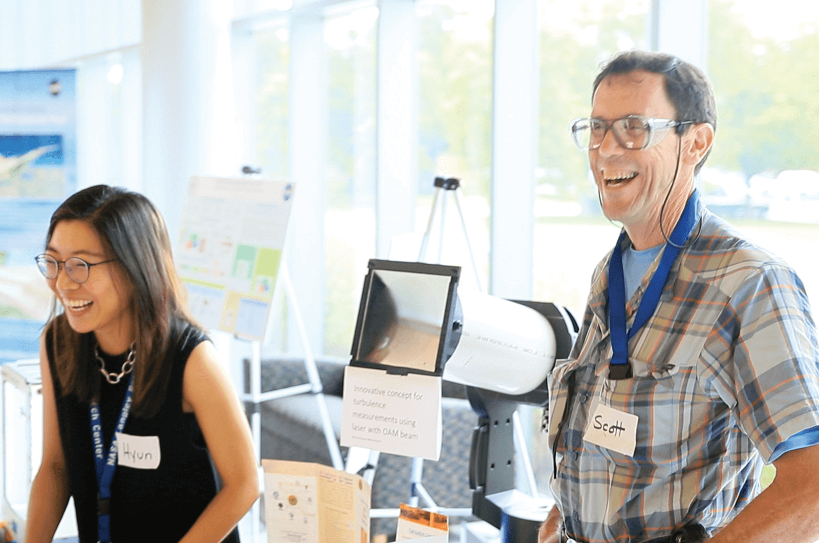 Toastmasters Hyun Jung Kim and Scott Bartram laughing