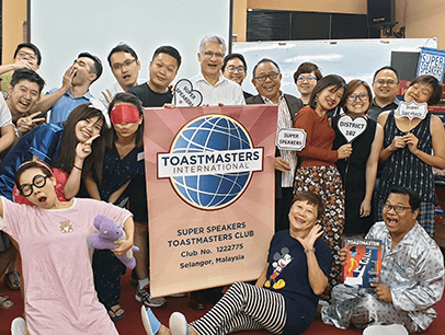 Toastmasters dressed in sleepwear during themed meeting
