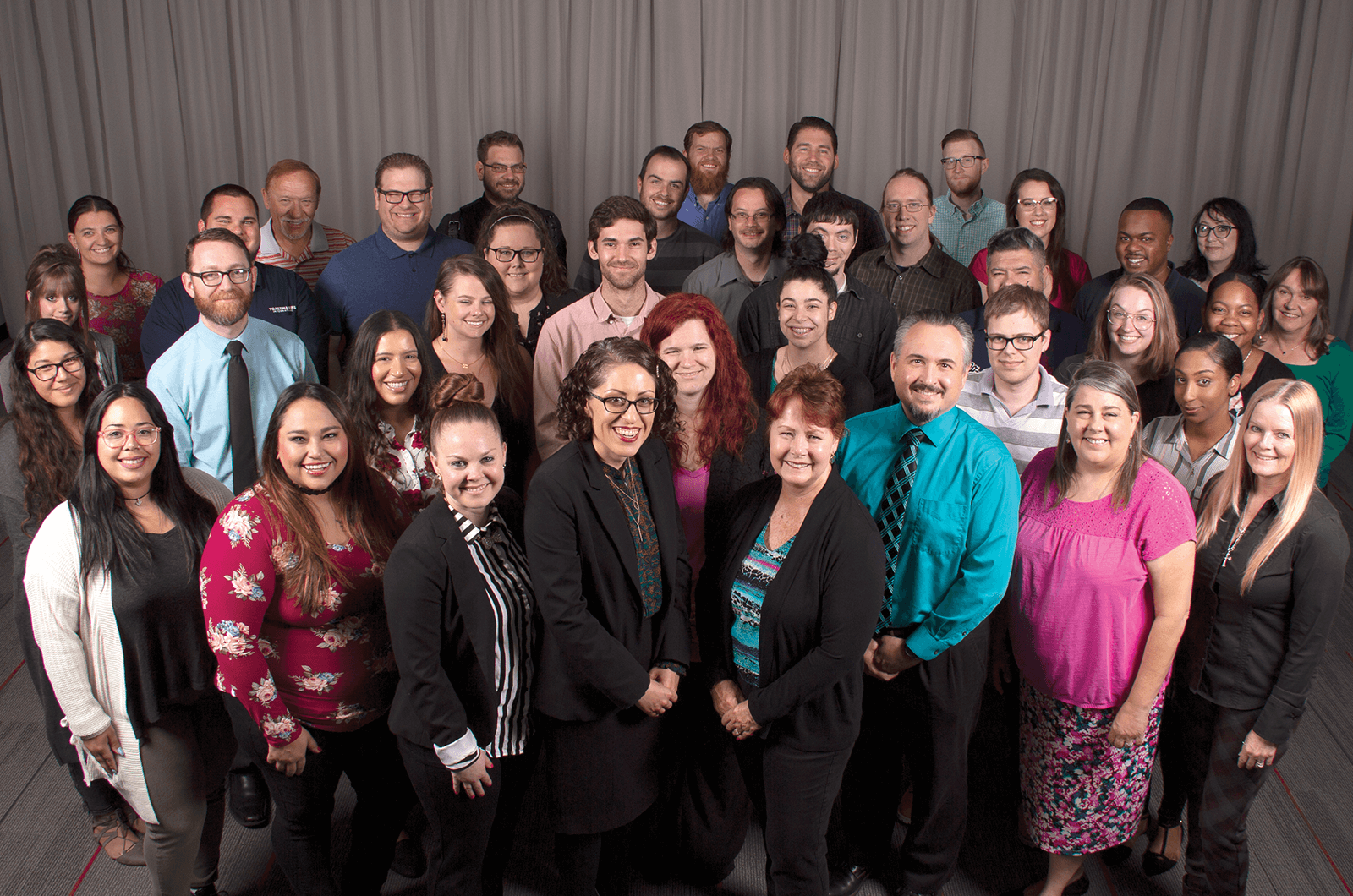 Toastmasters International World Headquarters Member Support staff posing in group photo