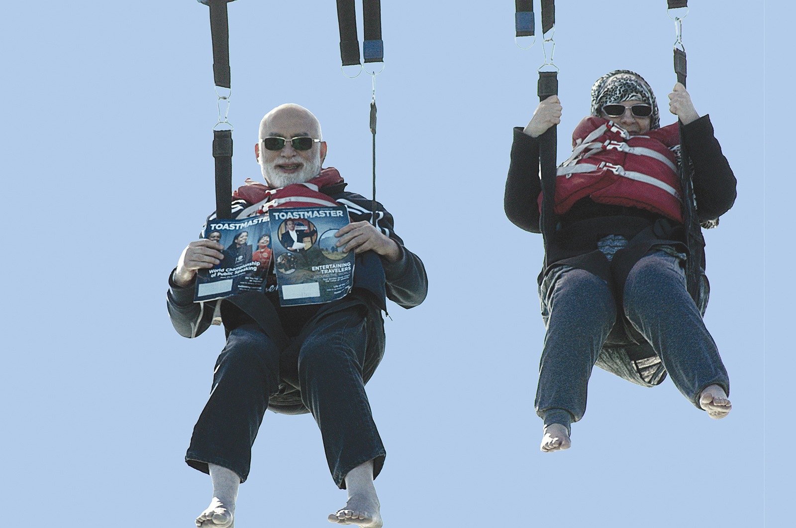 Mohomed Ikhlas Farid, DTM, and his wife, SHAISTA, of Doha, Qatar, take the Toastmaster to new heights while parasailing in Cape Canaveral, Florida.
