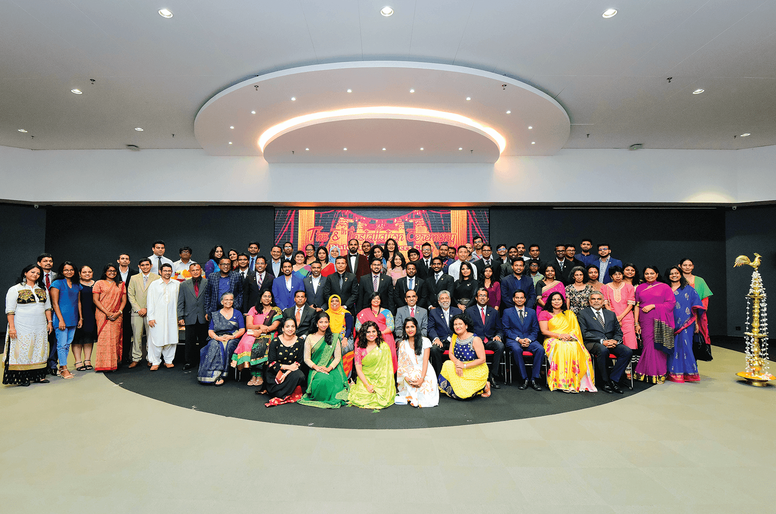 Group of Toastmasters members dressed in Bollywood-themed attire