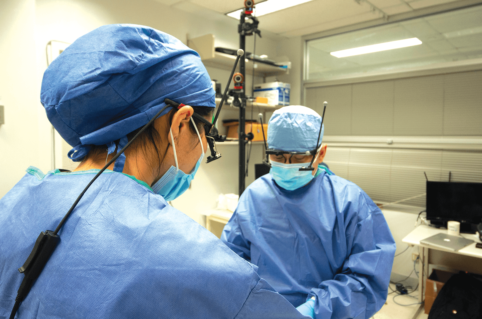 Two doctors perform a simulated surgery for training