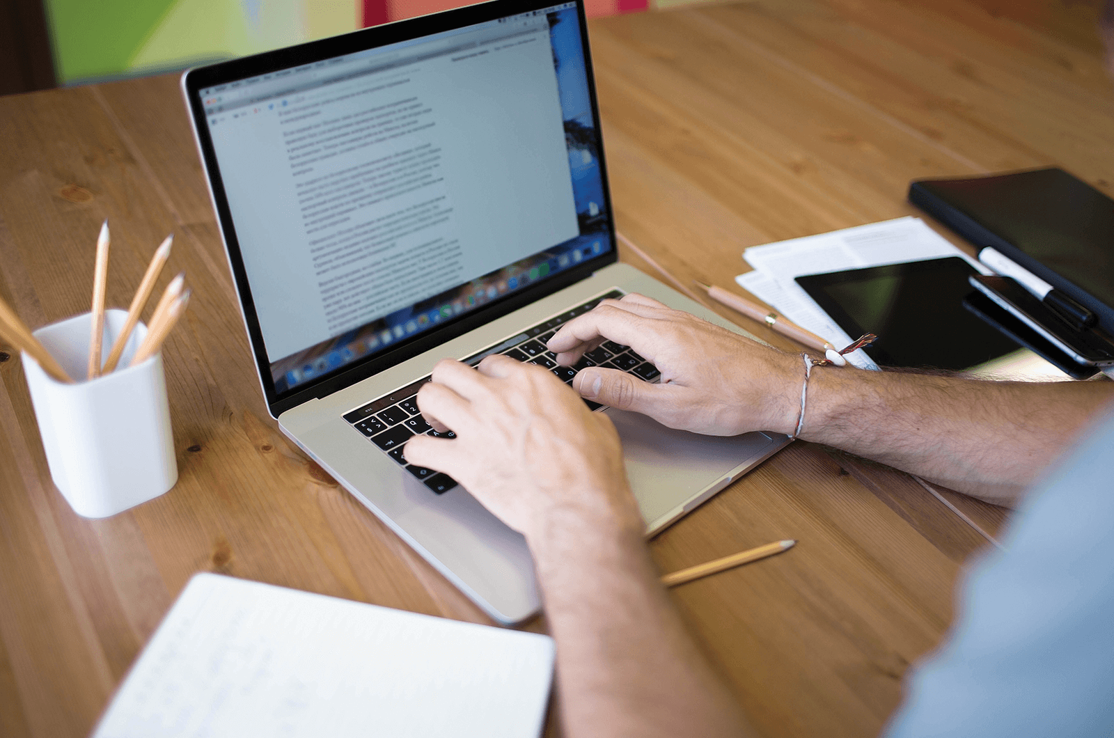 Someone typing on a laptop