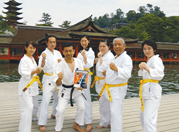 Club members pose in karate uniforms