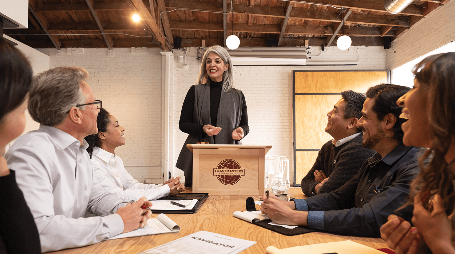 Woman standing at lectern speaking