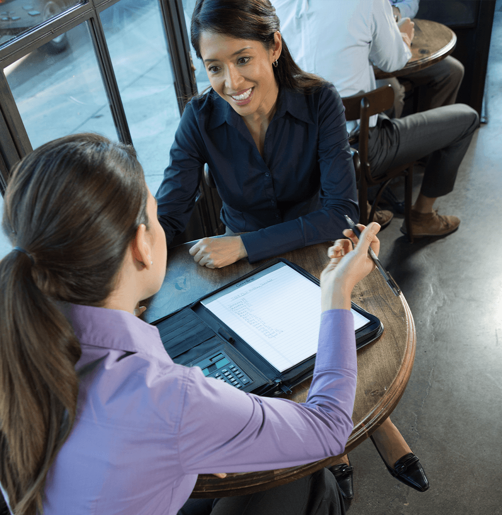 Two women working at a table