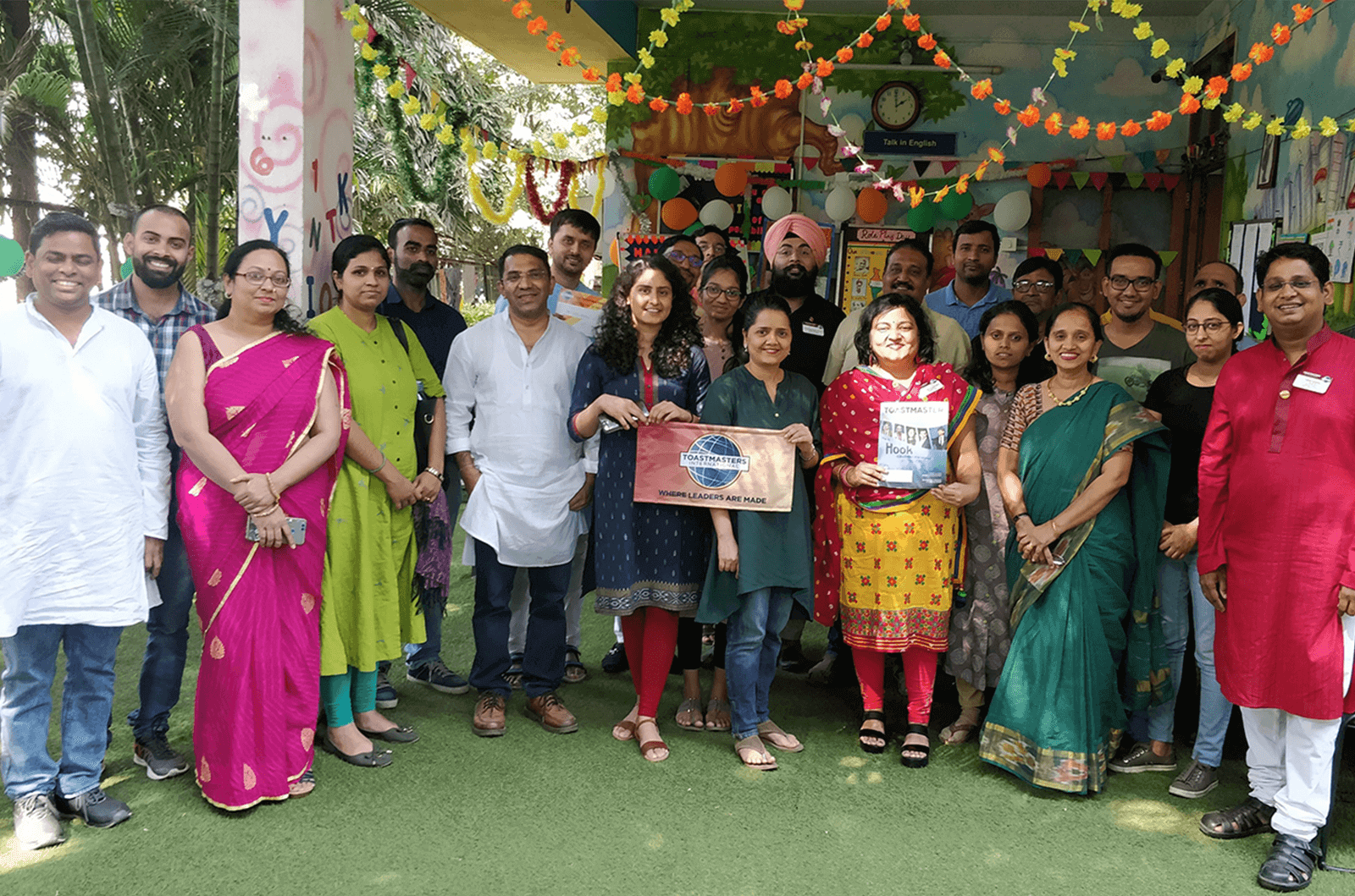 Group of Toastmasters members dressed in traditional Indian garb