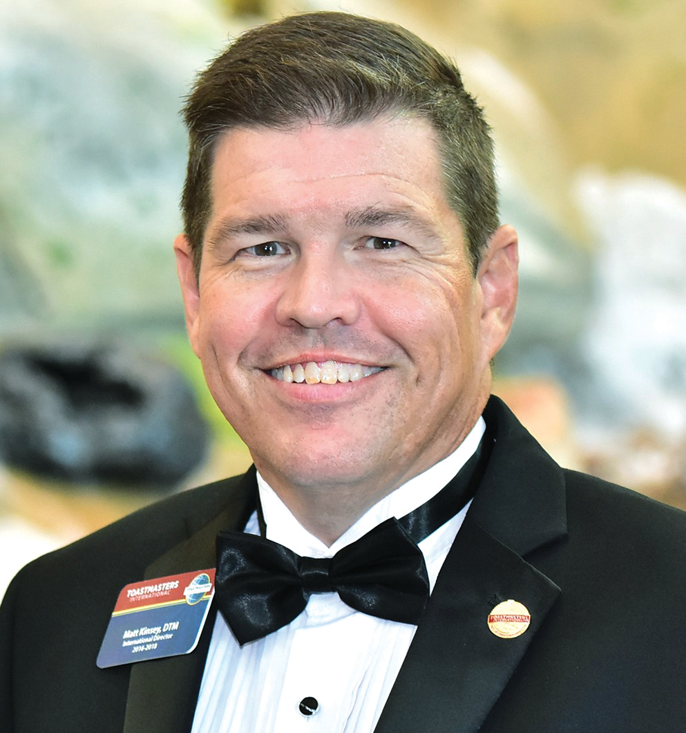 Matt Kinsey in suit and bowtie smiling 