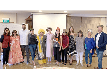 Kauai Toastmasters club gather on red carpet for awards-themed meeting