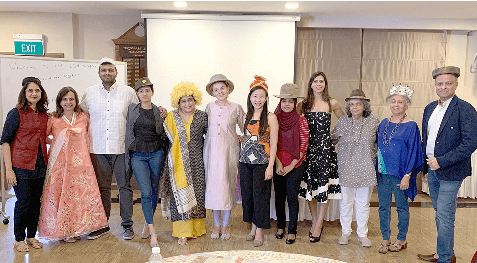 Kauai Toastmasters club gather on red carpet for awards-themed meeting