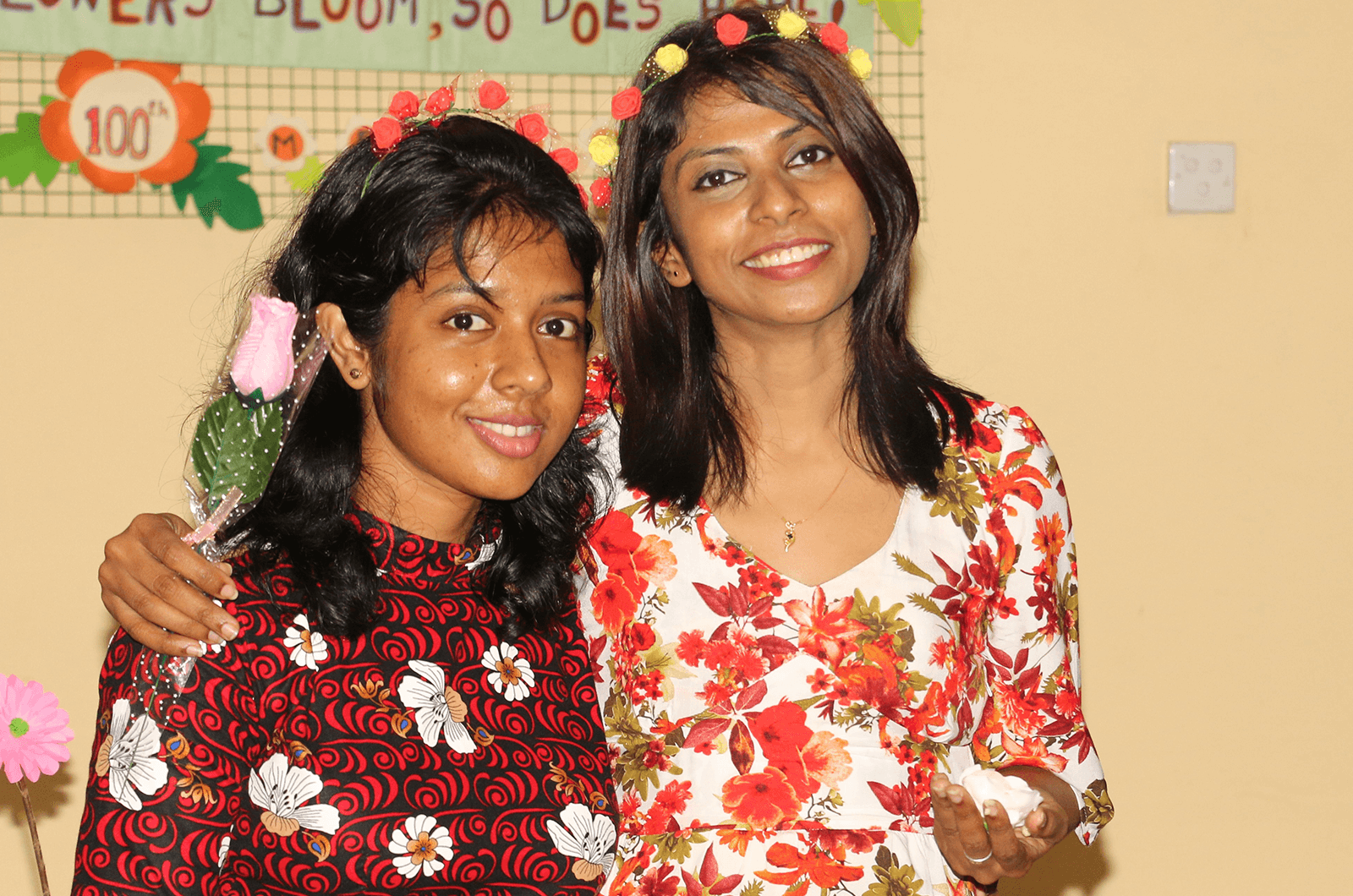 Two women smiling and posing