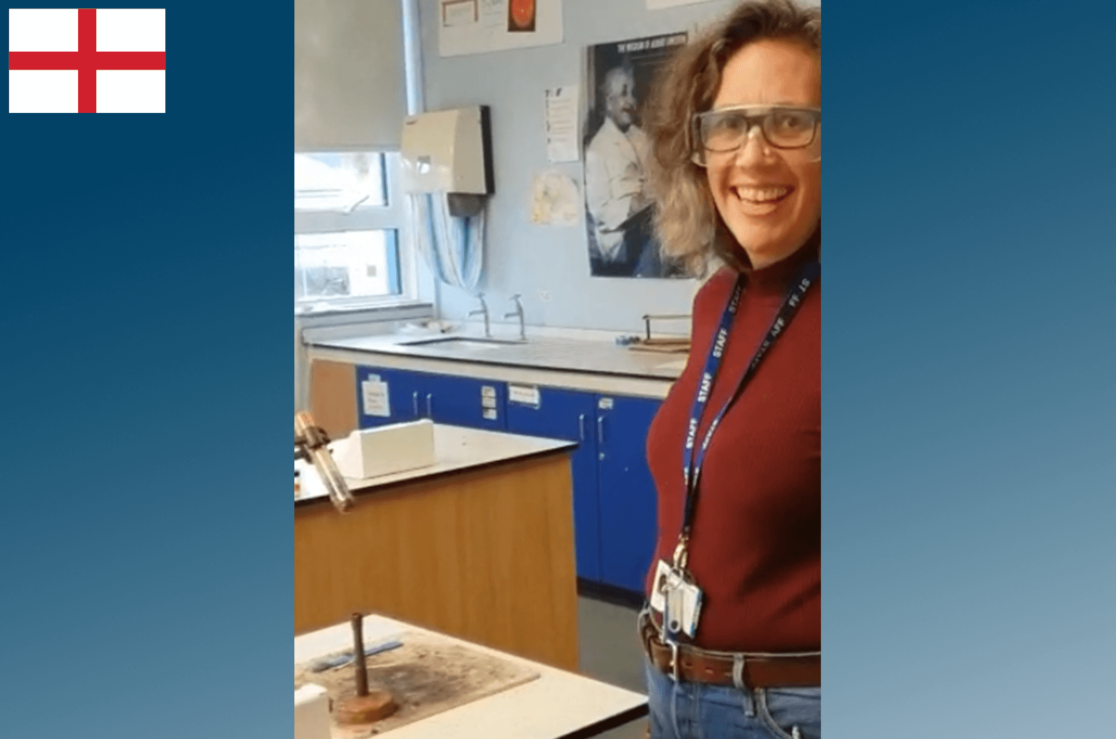 Woman wearing lanyard and smiling while teaching at school