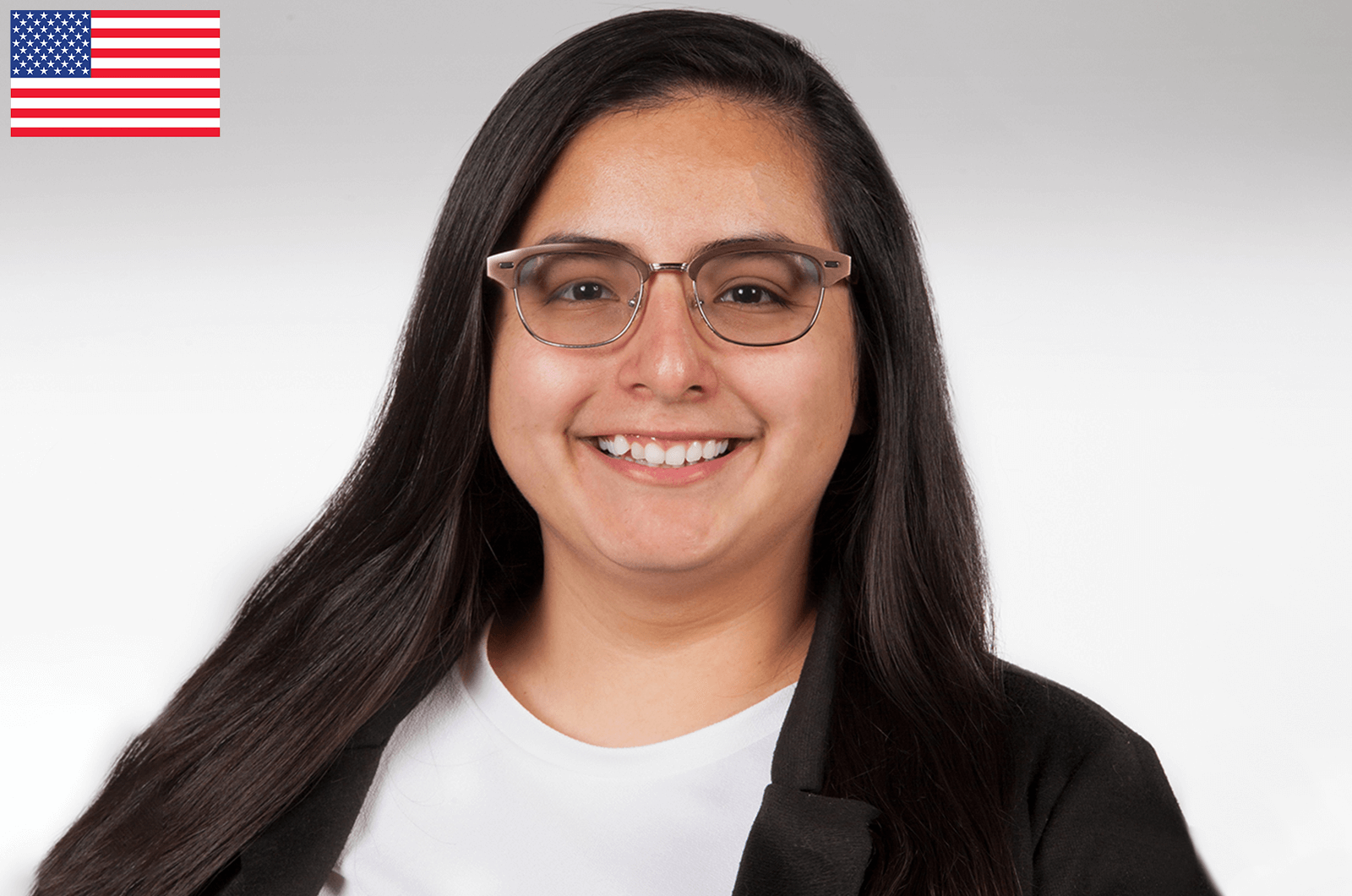 Beatriz Ibara in white shirt and black jacket smiling