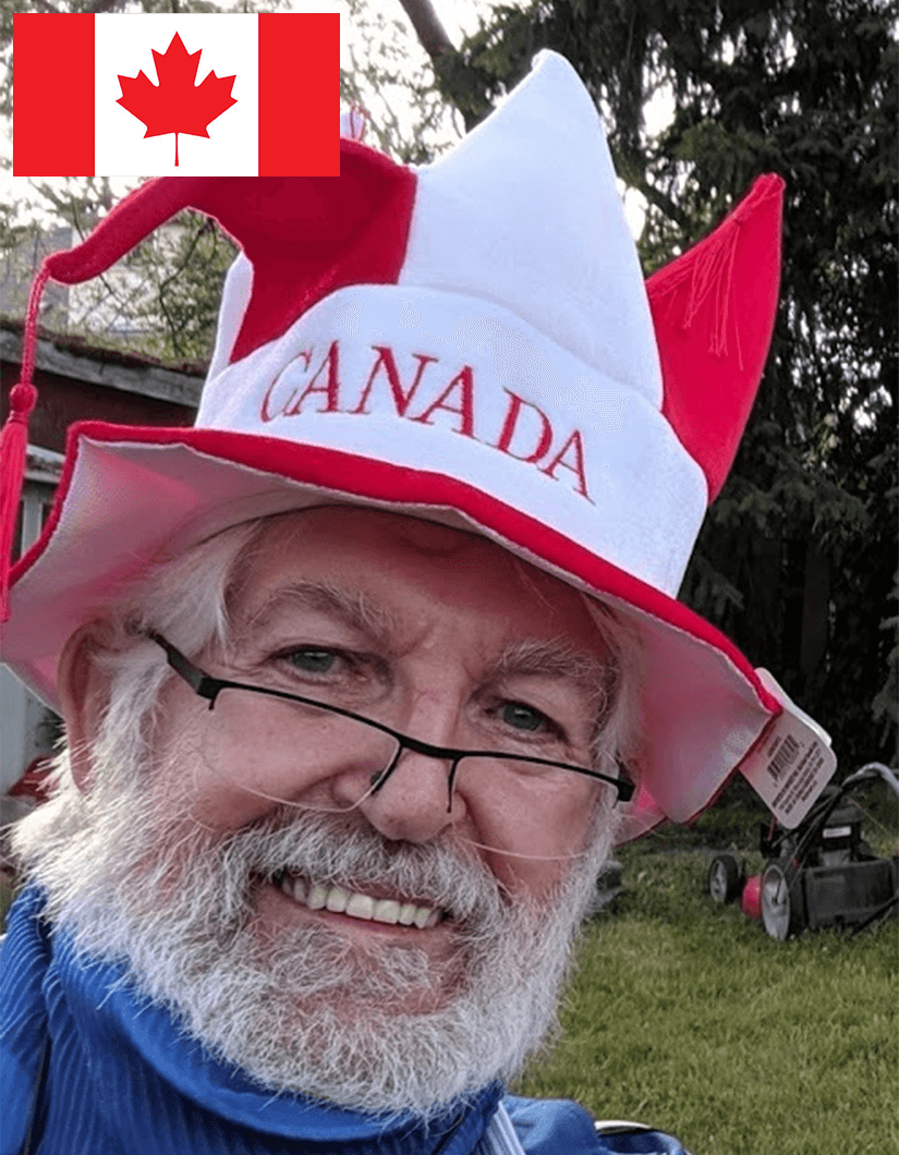 Brian Dodd smiling while wearing red and white Canada hat 