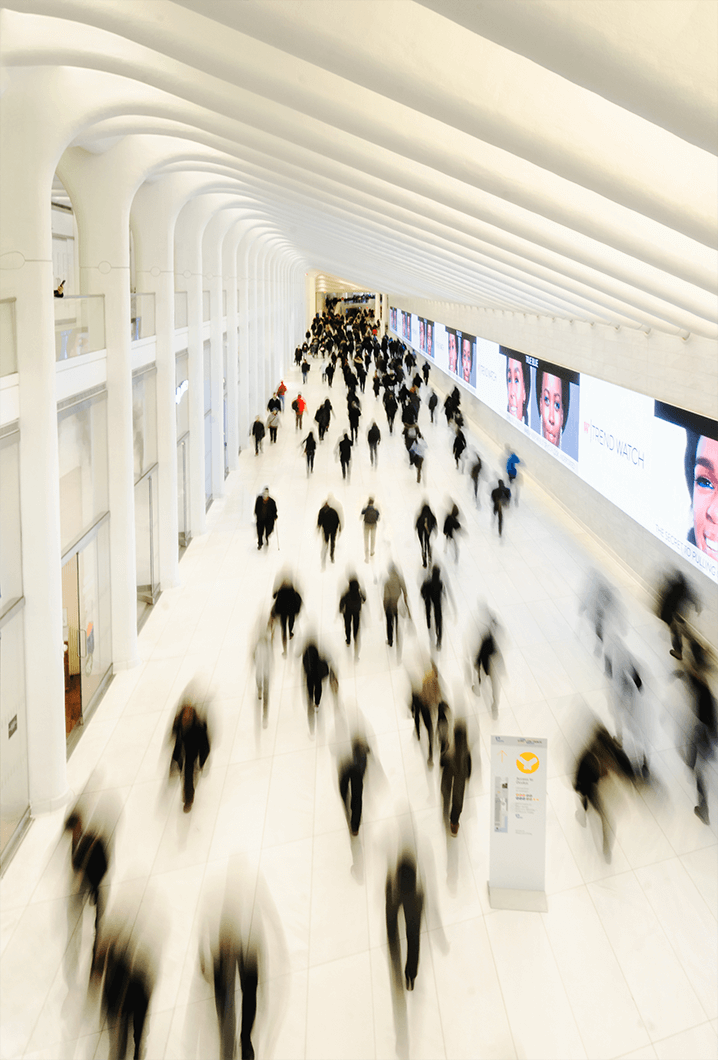 Blurred image of people walking through World Trade Center Station in New York City