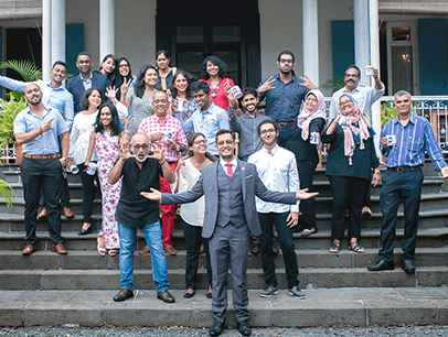 Group of people posing with gestures on staircase