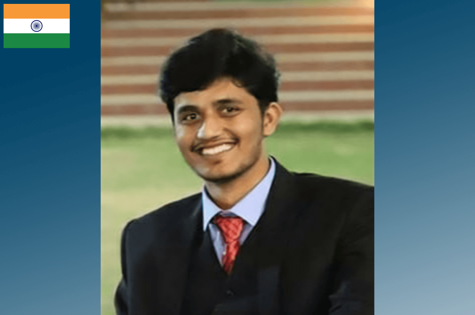 Young man in suit and tie smiling 