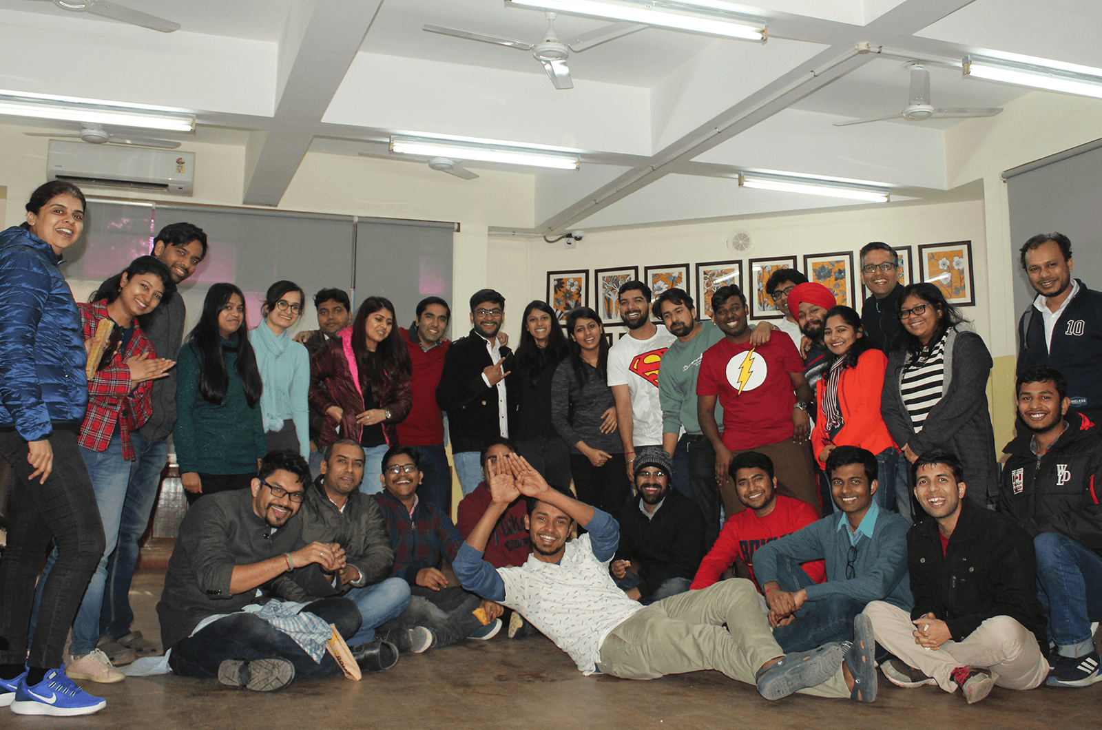 Group of people posing indoors