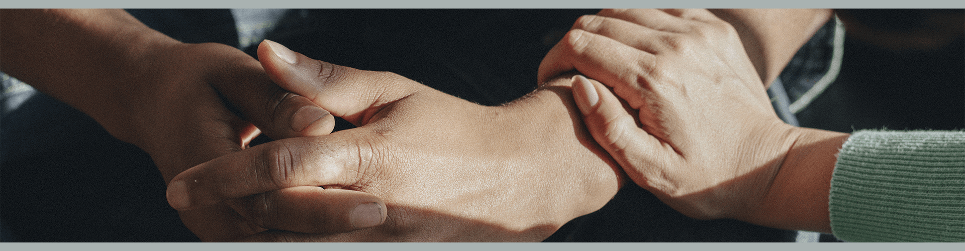 A hand embracing an arm