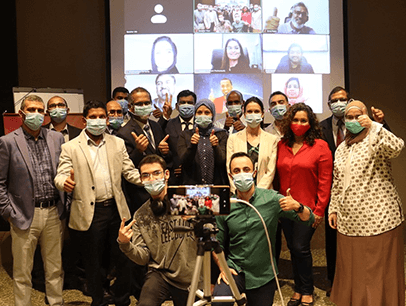 Group of people wearing masks during meeting