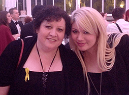 Two women posing and smiling