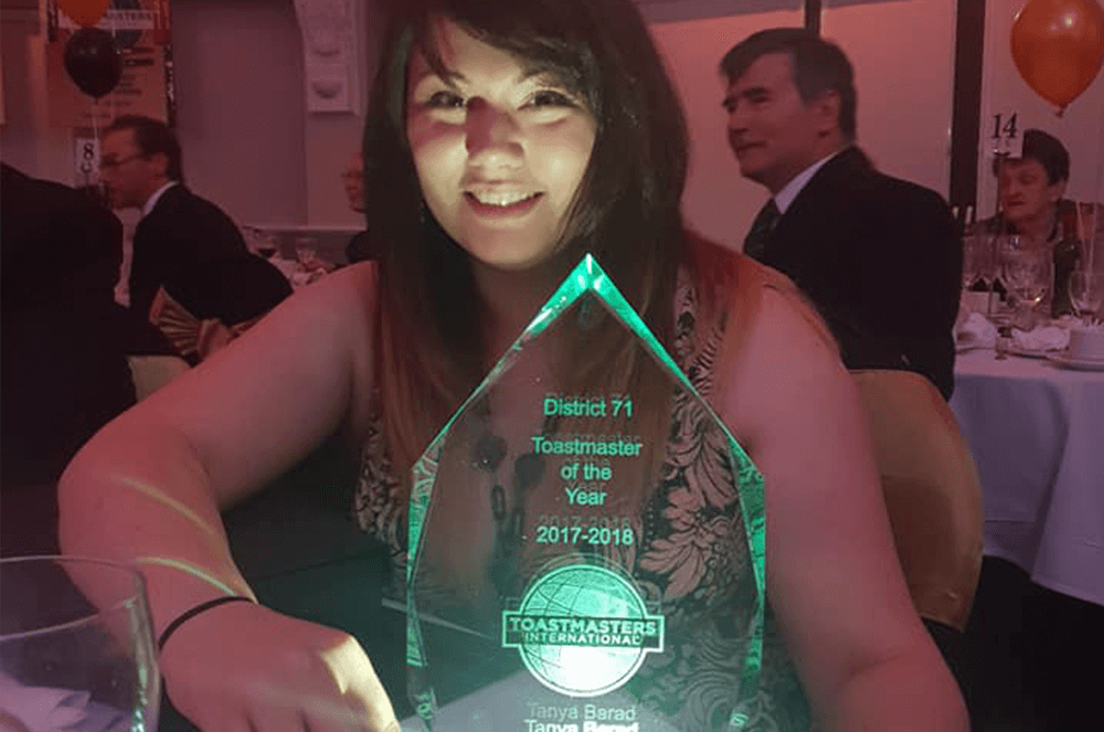 Tanya Barad poses with her trophy after winning Toastmaster of the Year for District 71 in the 2017 – 2018 year.