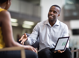 Man giving sales pitch with iPad
