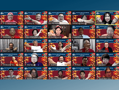 People on Zoom meeting holding oranges