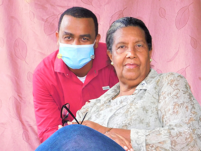 Man wearing mask posing next to woman