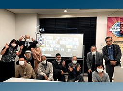 Group of people in masks posing